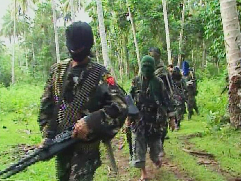 Abu Sayyaf rebels, circa 2009, are seen in the Philippines. It is estimated that the group has recieved more than $10 million in ransom money. Reuters file photo