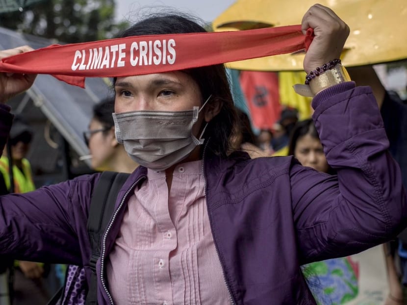 A climate protester marching to the State Palace in Jakarta on Sept 20, 2019.
