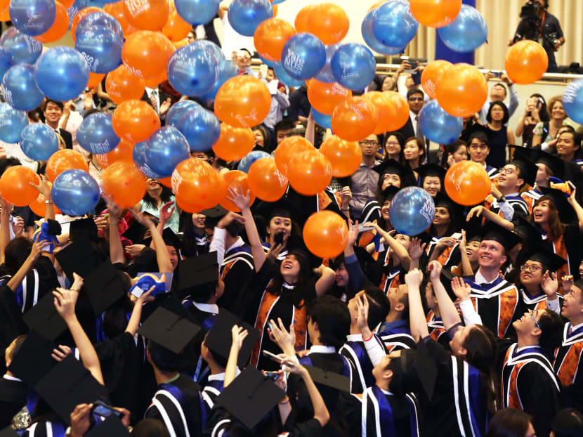 Students of the inaugural class of Yale-NUS College celebrate during their graduation ceremony. A survey by the Institute of Policy Studies found that an individual who speaks English at home has a higher desire to move overseas.