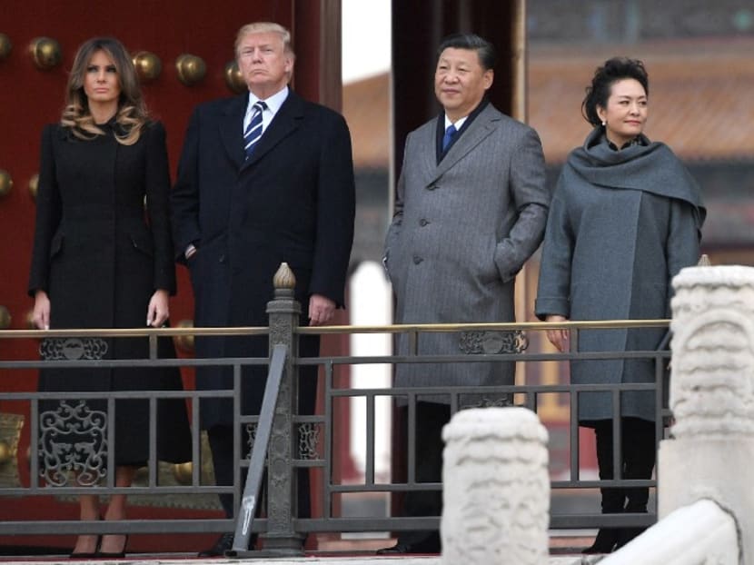 United States President Donald Trump, First Lady Melania Trump, Chinese President Xi Jinping and his wife Peng Liyuan touring the Forbidden City in Beijing on Nov 8, 2017. Photo: AFP