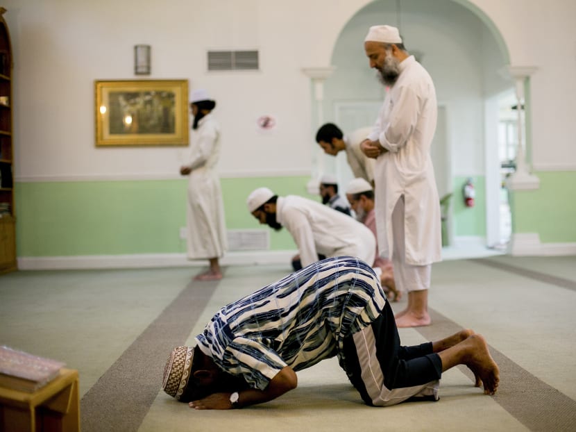 Worshipers pray at the Fort Pierce Islamic Center in Fort Pierce, Fla., June 13, 2016. Omar Mateen, who massacred 49 people and wounded 53 more at a gay nightclub in Orlando early Sunday morning, lived in Fort Pierce and prayed at the mosque several times a week. Photo: New York Times