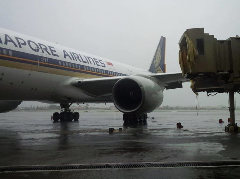 Gallery: Typhoon Rammasun causes SIA plane to hit aerobridge