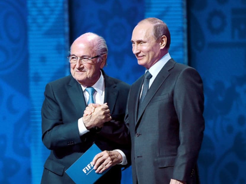 Sepp Blatter (left) and Vladimir Putin on stage for the speeches to open the draw ceremony on Saturday. Photo: Getty Images