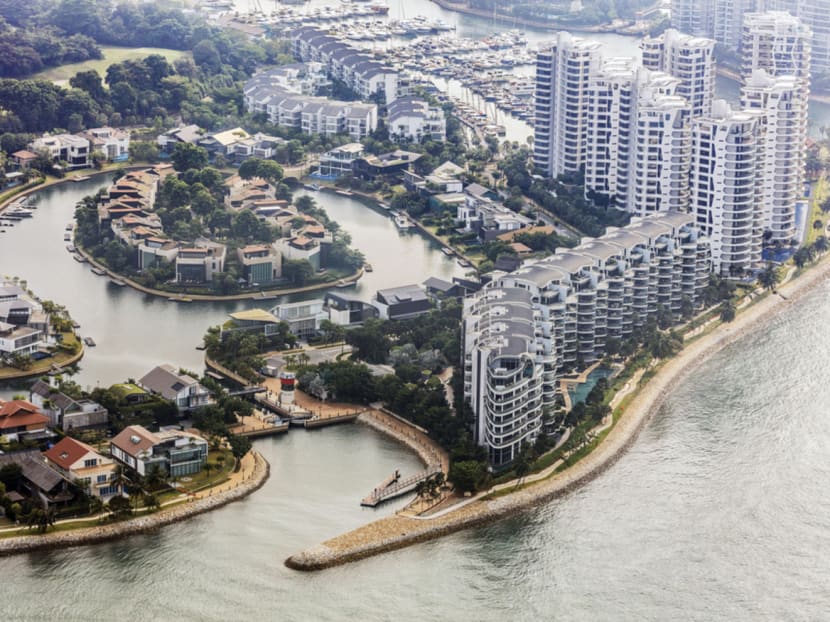 The Seascape, foreground right, and other luxury property developments at Sentosa Cove stand on Sentosa Island in this aerial photograph taken above Singapore, on Thursday, July 2, 2015. Bloomberg file photo
