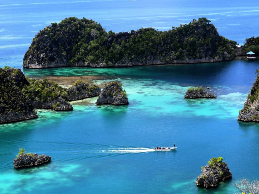 The blue sea around Raja Ampat in Indonesia's far eastern Papua. Stretching across 67,000 sq km, the postcard-perfect islands might be about as close to paradise as visitors can find. Photo: AFP