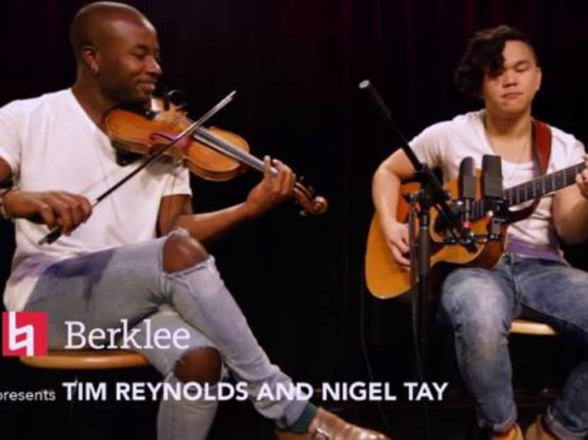 Violinist Tim Reynolds and Malaysian guitarist Nigel Tay, seen in this screenshot from the Berklee Music College, do an instrumental cover of two popular Taylor Swift songs.