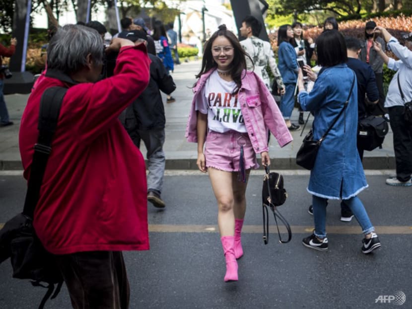 Across Asia, why are more men carrying women's handbags? - CNA Luxury