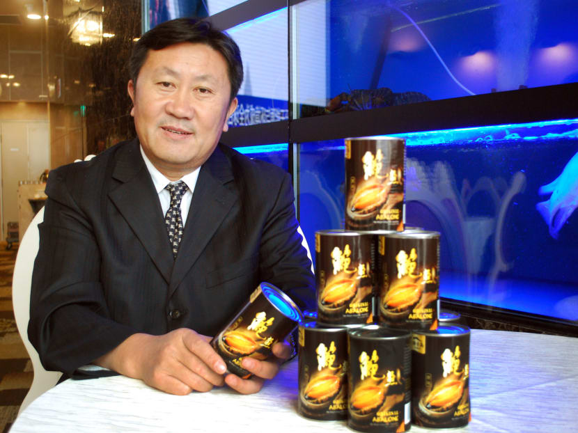 Zhangzidao chairman and president Wu Hougang with his company’s abalone products. Photo: Angela Teng