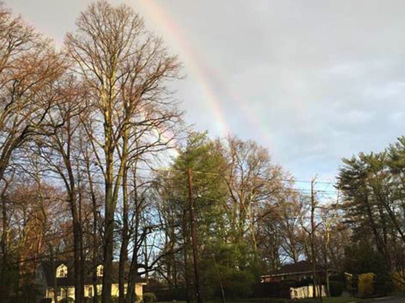 In this photo provided by Amanda Curtis, rainbows appear in the sky at a Glen Cove train station yesterday (April 21), on Long Island in New York. Photo: AP