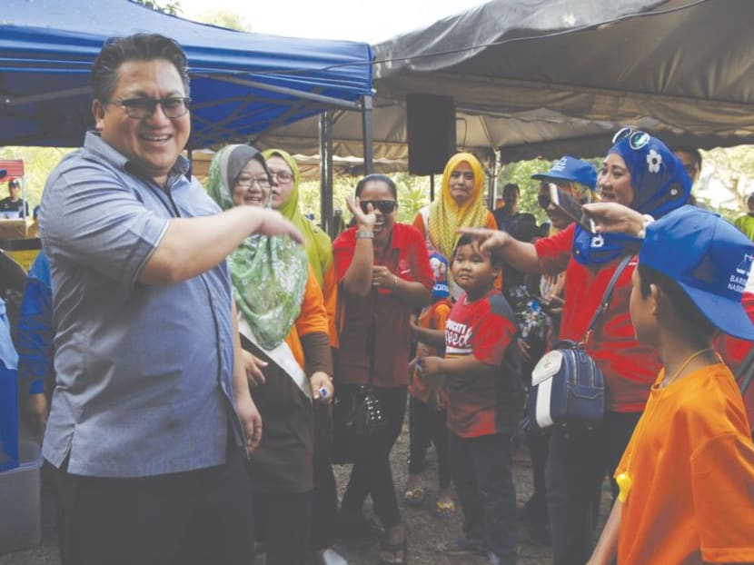 Malaysian Deputy Home Minister Nur Jazlan Mohamed, seen here with constituents in Taman Perling, said on Wednesday (Oct 18) that the new recognition systems will work together with the biometric devices that are currently in use.