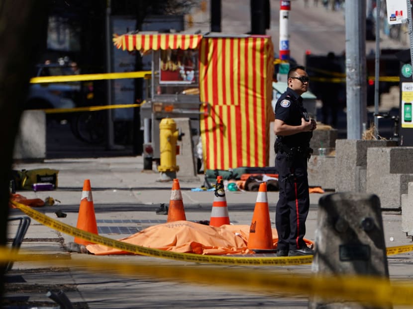Photo of the day: A police officer standing next to a victim of an incident where a van struck multiple people at a major intersection in Toronto, Canada on Monday (April 23).
