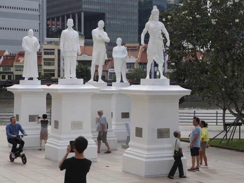 Statues of Sang Nila Utama, Tan Tock Seng, Munshi Abdullah and Naraina Pillai placed temporarily beside the statue of Sir Stamford Raffles along Singapore River on January 4, 2019 as part of the Singapore Bicentennial celebrations.