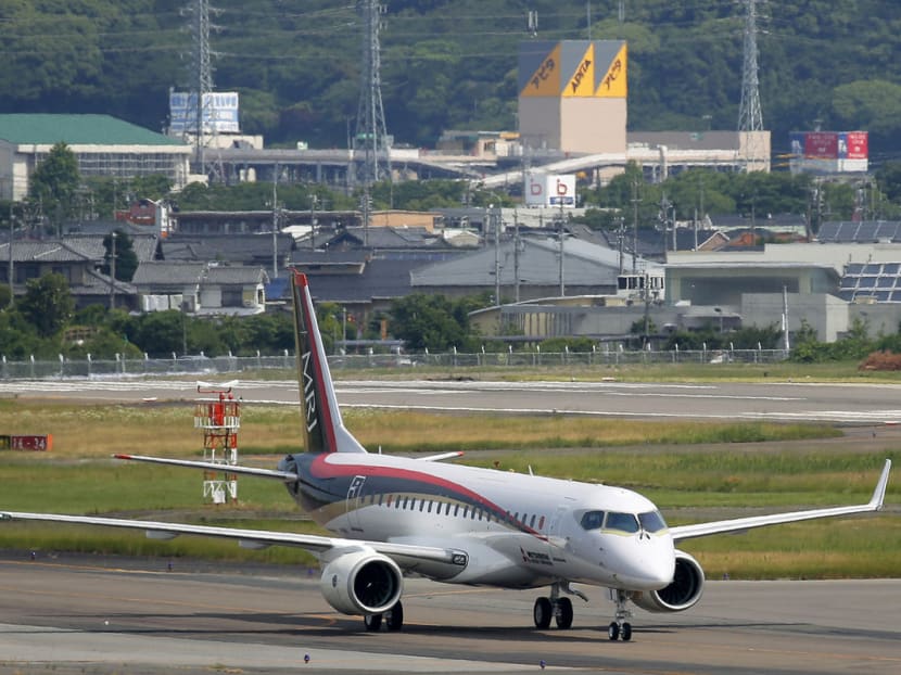 A Mitsubishi Regional Jet passenger aircraft taxies during a low speed taxiing test at Prefectural Nagoya Airport in Toyoyama Town. Photo: Bloomberg