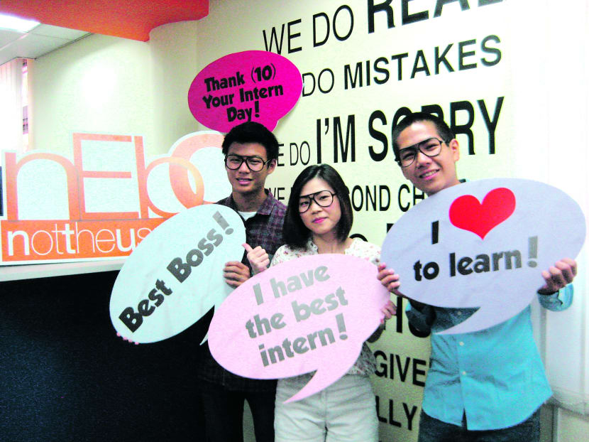 Thank Your Intern Day team members Ryan Teo (left) and Brendan Lim with mentor Gigi Low from nEbO wearing oversized black glasses, the signature item for the campaign. Photo: nEbo