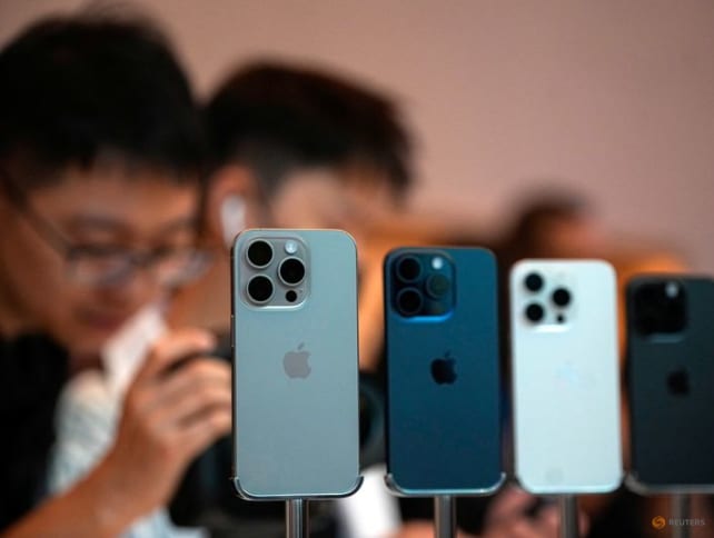 People look at the new iPhone 15 Pro as Apple's new iPhone 15 officially goes on sale across China at an Apple store in Shanghai, China on Sept 22, 2023.