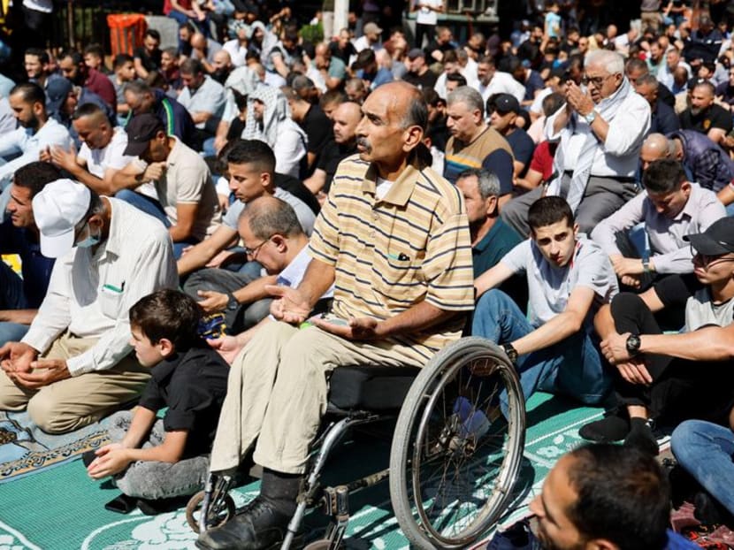 West Bank Palestinians across political divides march in solidarity