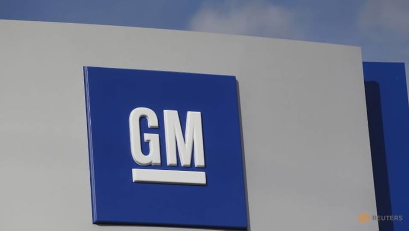 GM hit by chip shortage, to cut production at four plants