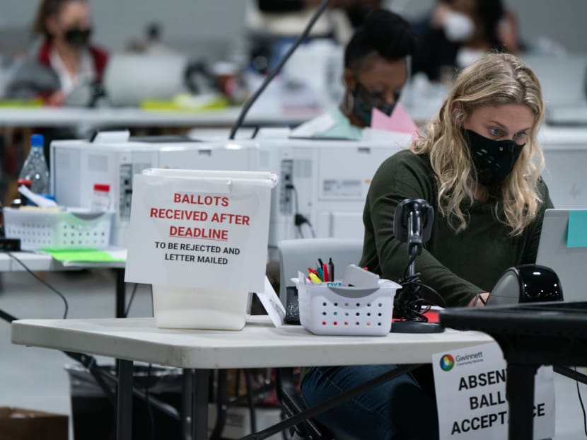 Election personnel check in provisional ballots at the Gwinnett County Board of Voter Registrations and Elections offices on Nov 7, 2020 in Lawrenceville, Georgia.