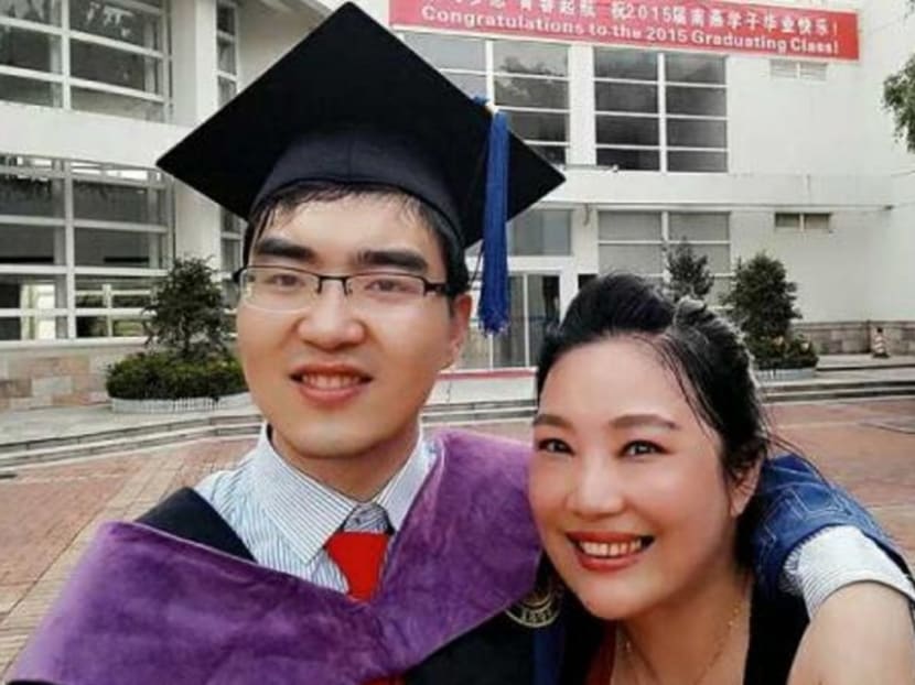 Ding Ding with his mother Zuo Hongyan at his master’s degree graduation at Peking University in 2015. Photo: Handout via South China Morning Post