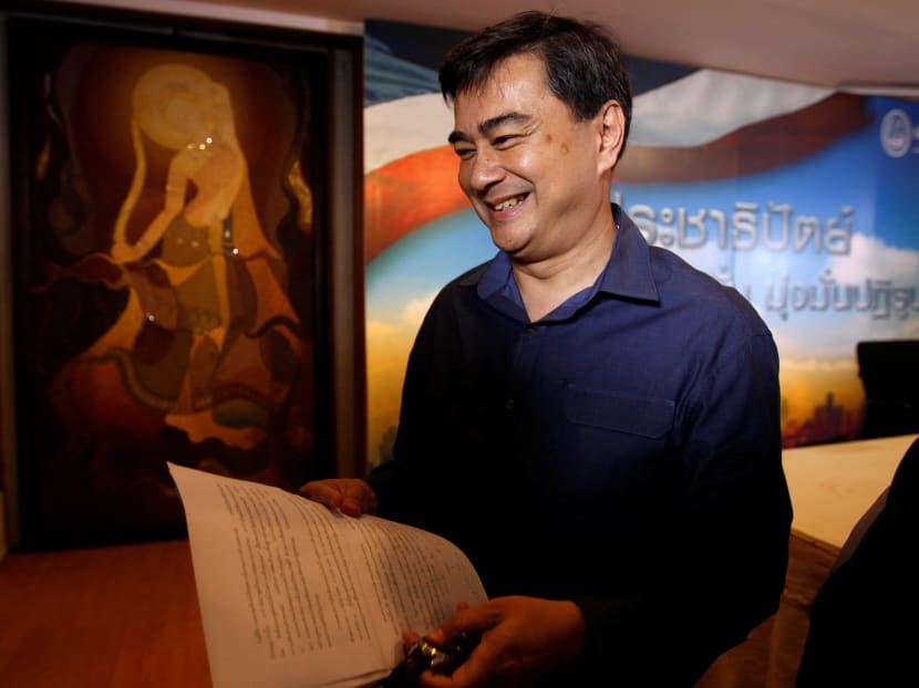 Abhisit Vejjajiva, leader of Thailand's Democrat Party, leaves a news conference after speaking about his personal position on the draft charter in Bangkok, Thailand, on July 27, 2016. Photo: Reuters