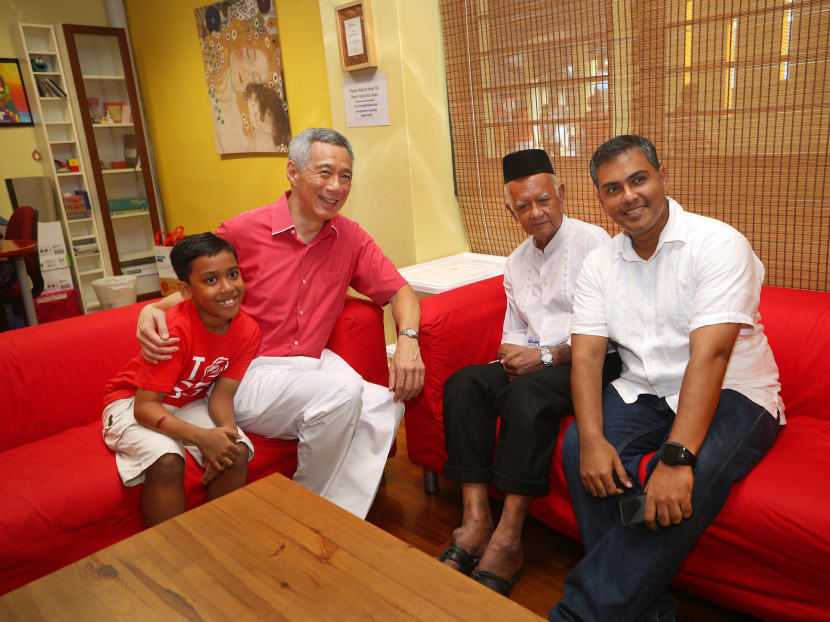 Mr Aziz, his father Ahmad Azali, 79, and son Adam, were held up by Prime Minister Lee Hsien Loong at the National Day Rally as an example of the importance of building for future generations. Photo: Ministry of Communications and Information