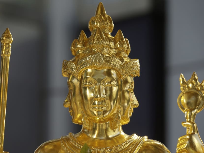 Gallery: Thais unveil restored statue at bomb site to boost morale