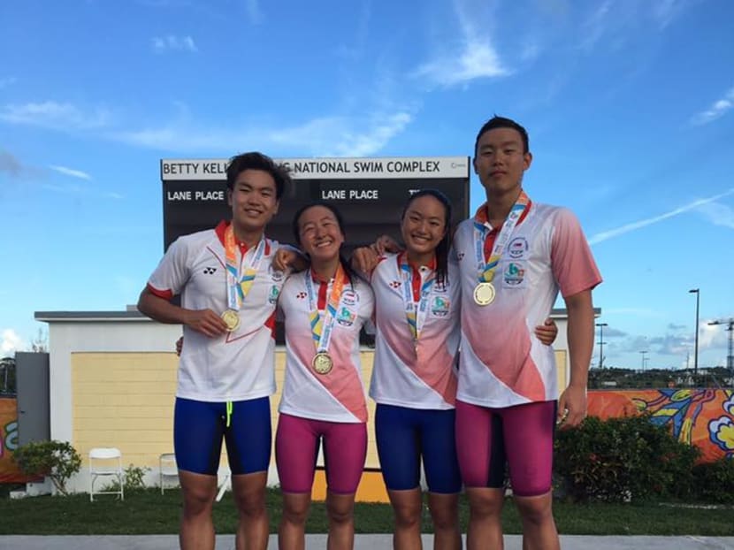 The Singapore 4x100m mixed relay team are all smiles with their gold medals. Photo: Singapore Swimming Association