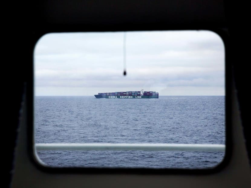 A China Shipping Line cargo ship sails sails the North Pacific Ocean off the coast of Alaska past the Finnish icebreaker MSV Nordica. Photo: AP