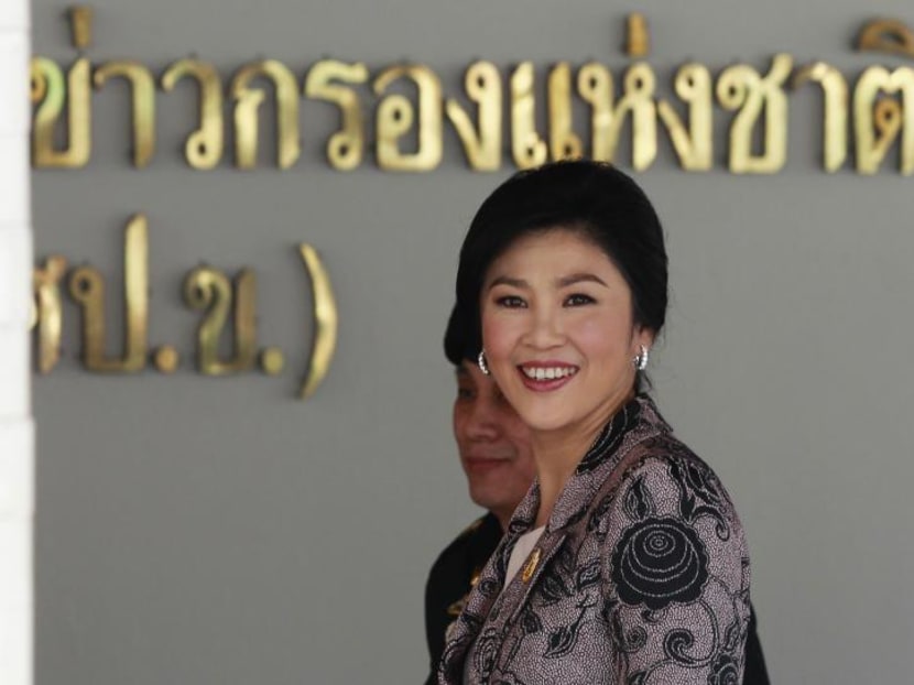 Thailand's Prime Minister Yingluck Shinawatra smiles as she arrives at the Internal Security Operations Command in Bangkok, Jan 3, 2014. Photo: Reuters