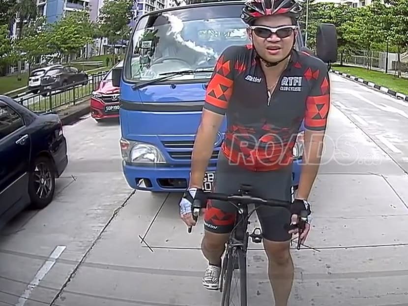 In a video posted on Roads.sg, a cyclist was seen hitting a lorry's side mirror after being honked at by a lorry driver.