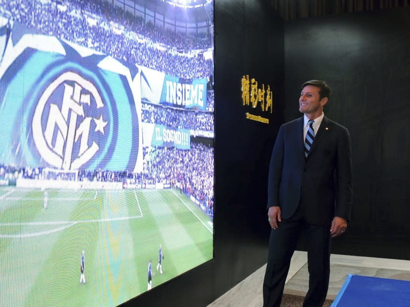 Chinese firms such as Suning, which recently bought a majority stake in Inter Milan, are being courted by footballing body FIFA for their funds. Photo: AP