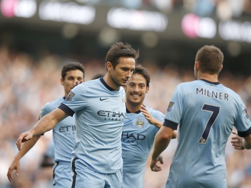 Frank Lampard (centre) saw little to celebrate 
with his joyous team-mates after his equaliser against former club Chelsea. Photo: Reuters