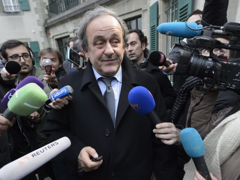 UEFA-President Michel Platini of France is surrounded by media after a hearing at the international Court of Arbitration for Sport, CAS, in Lausanne, Switzerland, Tuesday, Dec. 8, 2015. Photo: AP