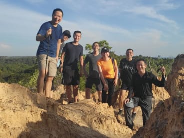 The writer (third from left) hiking in Brunei with colleagues and Singapore healthcare professionals during a work trip there with them.
