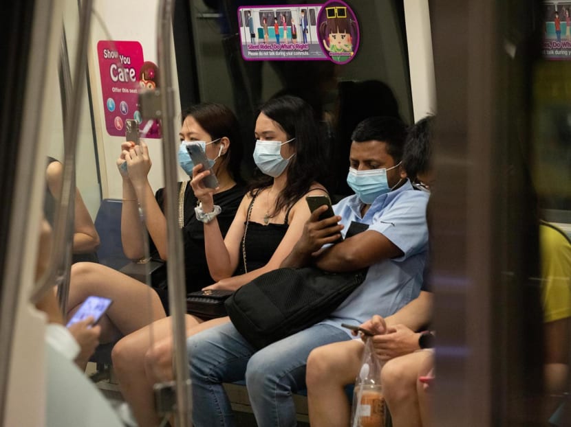 Passengers wearing face masks in an MRT train in Singapore.