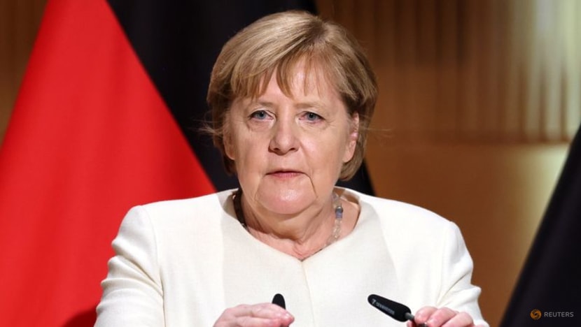 Emotional Merkel, marking German reunification, calls for tolerance Emotional Merkel, marking German reunification, calls for tolerance