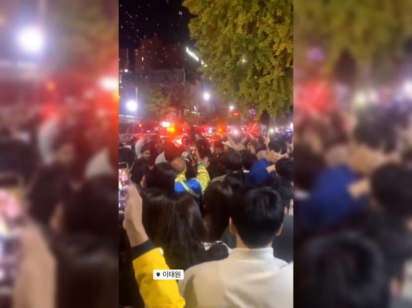 A crowd of revellers were filmed partying next to emergency vehicles that were responding to a fatal crowd crush in the Itaewon district of Seoul, South Korea.