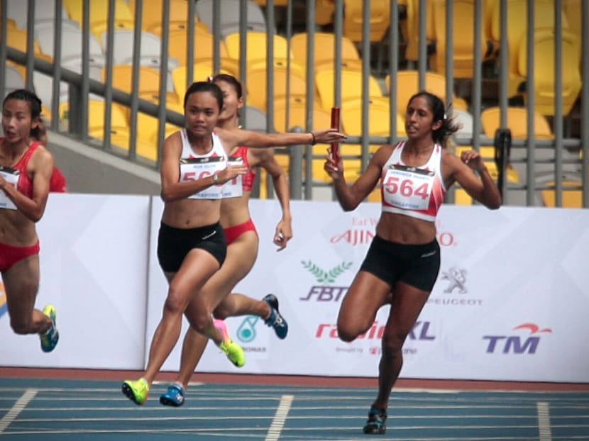 Shanti Pereira and Nur Izlyn compete in the SEA Games women's 4x100m relay on August 25, 2017. Photo: Jason Quah/TODAY