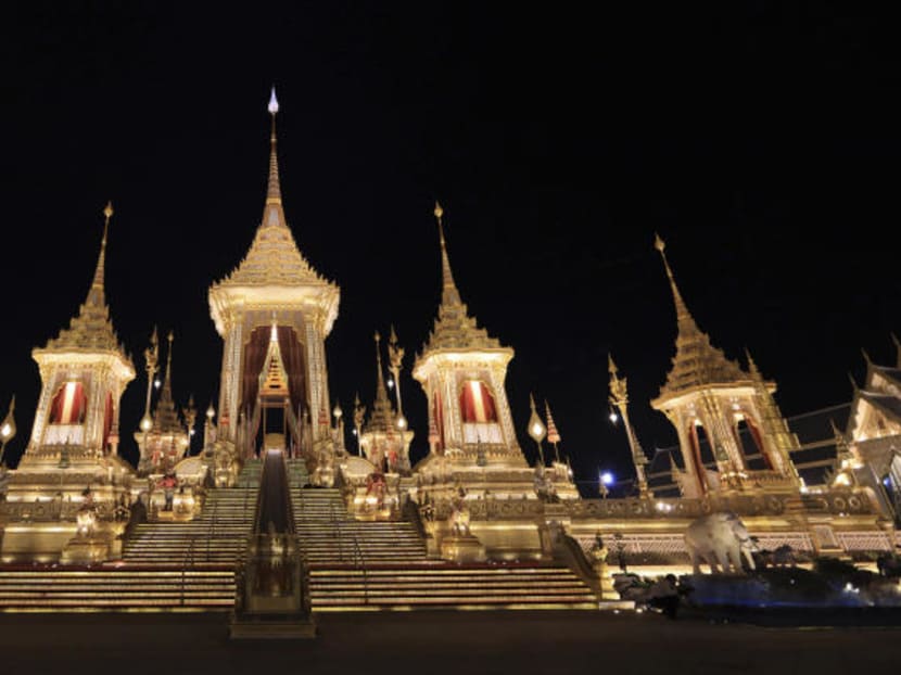 Night falls on the warmly lit royal crematorium and funeral complex for the late Thai King Bhumibol Adulyadej Bangkok, Thailand, Friday, Oct. 20, 2017. Bhumibol will be honored in an elaborate royal cremation ceremony from Oct. 25 to 29. Photo: AP