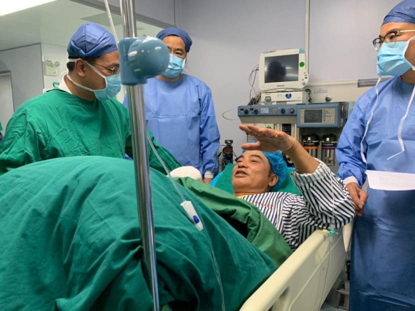 Actor Simon Yam returns to Hong Kong after knife attack in southern