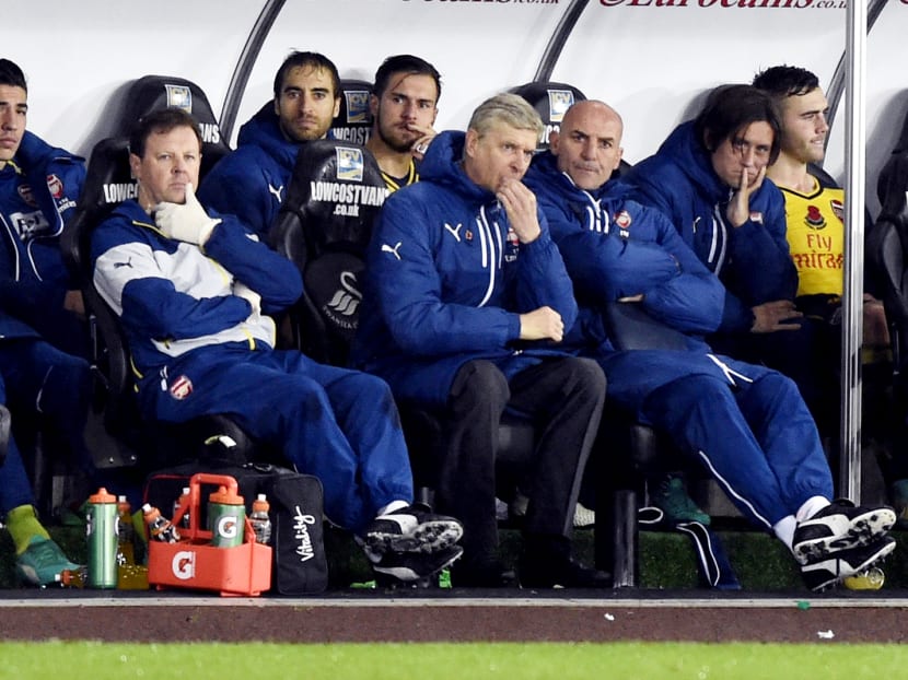 Arsenal manager Arsene Wenger and his bench after the club’s 2-1 defeat to Swansea City at the 
Liberty Stadium in Swansea, Wales, last week. PHOTO: REUTERS