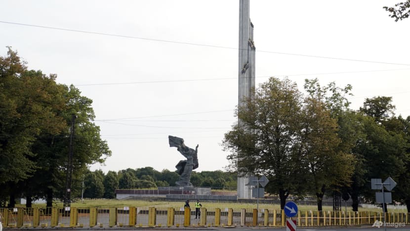 Soviet-era monument's iconic obelisk comes down in Latvia