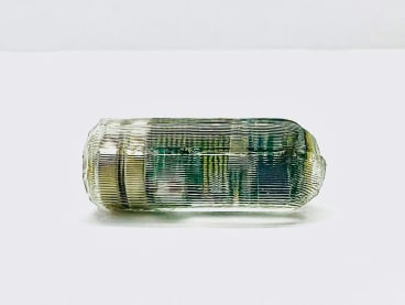 A photo of an ingestible smart pill for wireless gastrointestinal tract monitoring which vibrates to relieve constipation and includes a sensor that can be tracked in the intestines.