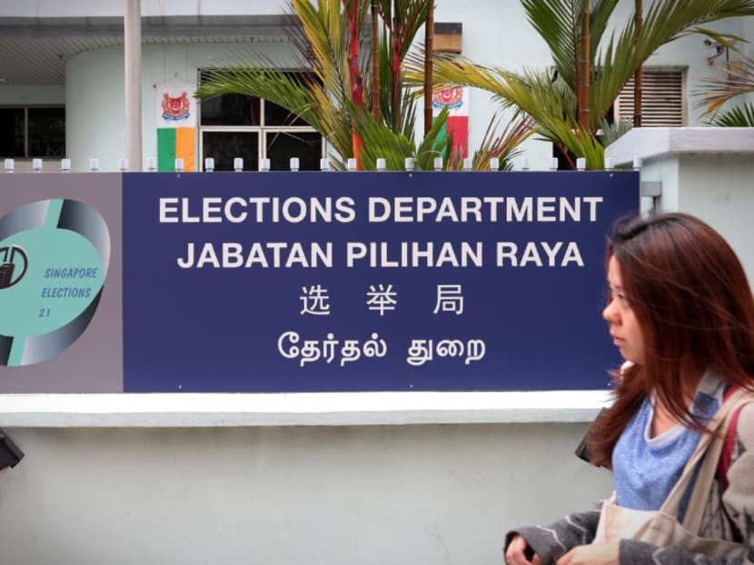 A member of the public walks past the Elections Department. TODAY file photo
