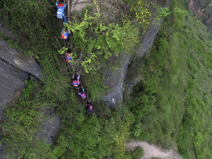 Village where children climb cliffside ladder may get stairs