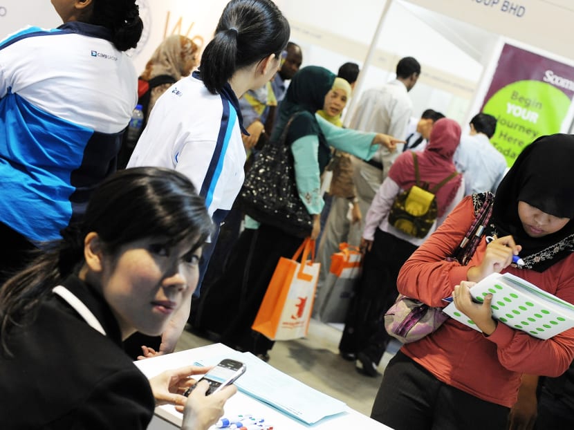 Job seekers during a job fair in Kuala Lumpur. Photo: AFP