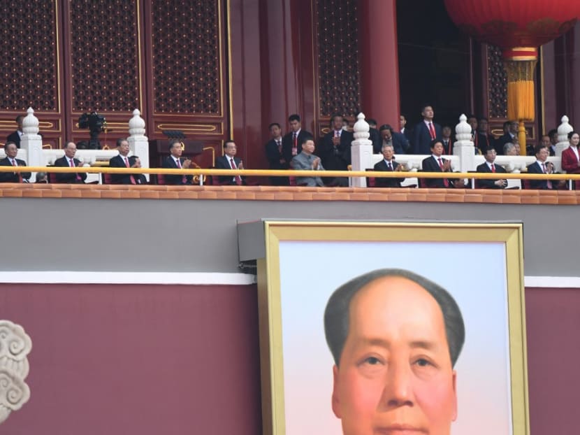 Chinese President Xi Jinping (centre) attends the celebration of the 100th anniversary of the founding of the Communist Party of China at Tiananmen Square in Beijing on July 1, 2021.