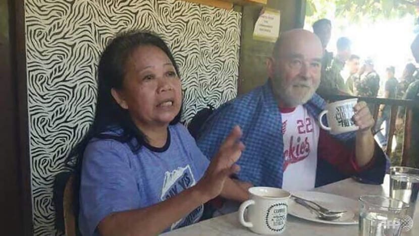 Freed UK hostage and wife say chained, threatened in Philippines Freed UK hostage and wife say chained, threatened in Philippines
