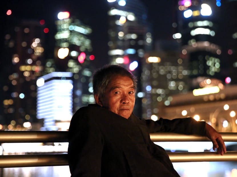 For the last four months, odd-job worker Chua Teo Aik, 64, has been wandering the streets by day. He sleeps by the waterfront in the Marina Bay area at night. Photo: Nuria Ling/TODAY