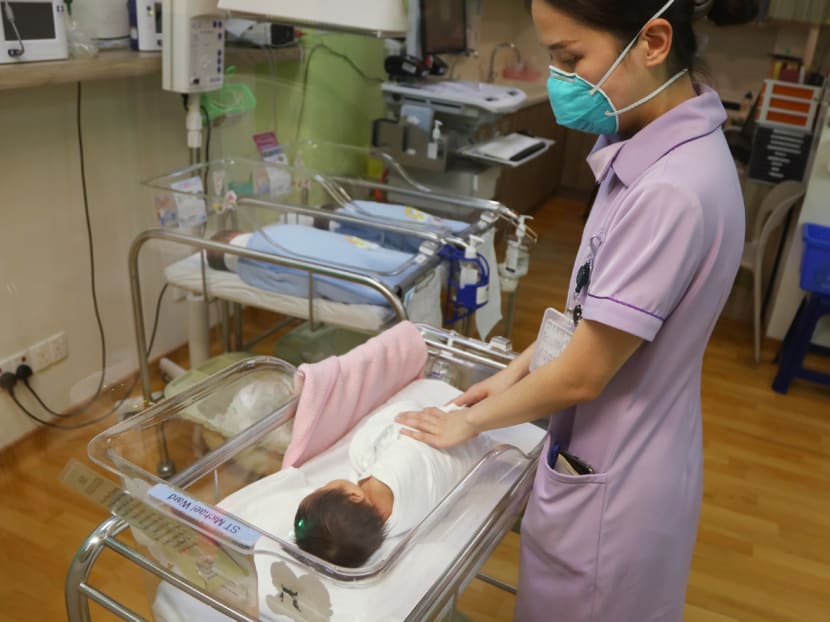 A nurse swaddling a newborn baby at Mount Alvernia Hospital.